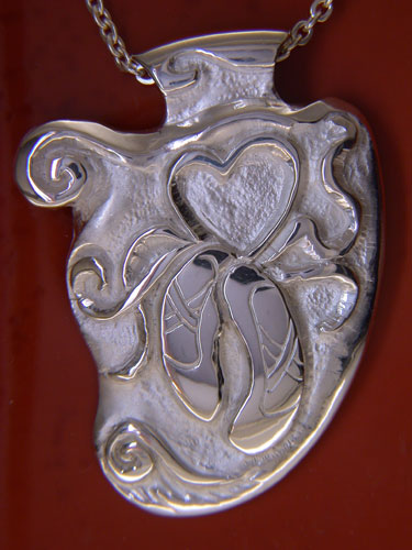 Hand-Carved Pendant with ballet and waves motif